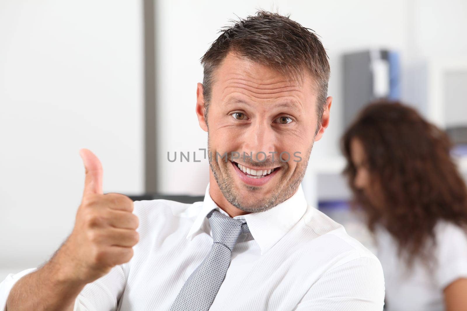 happy businessman with thumb up