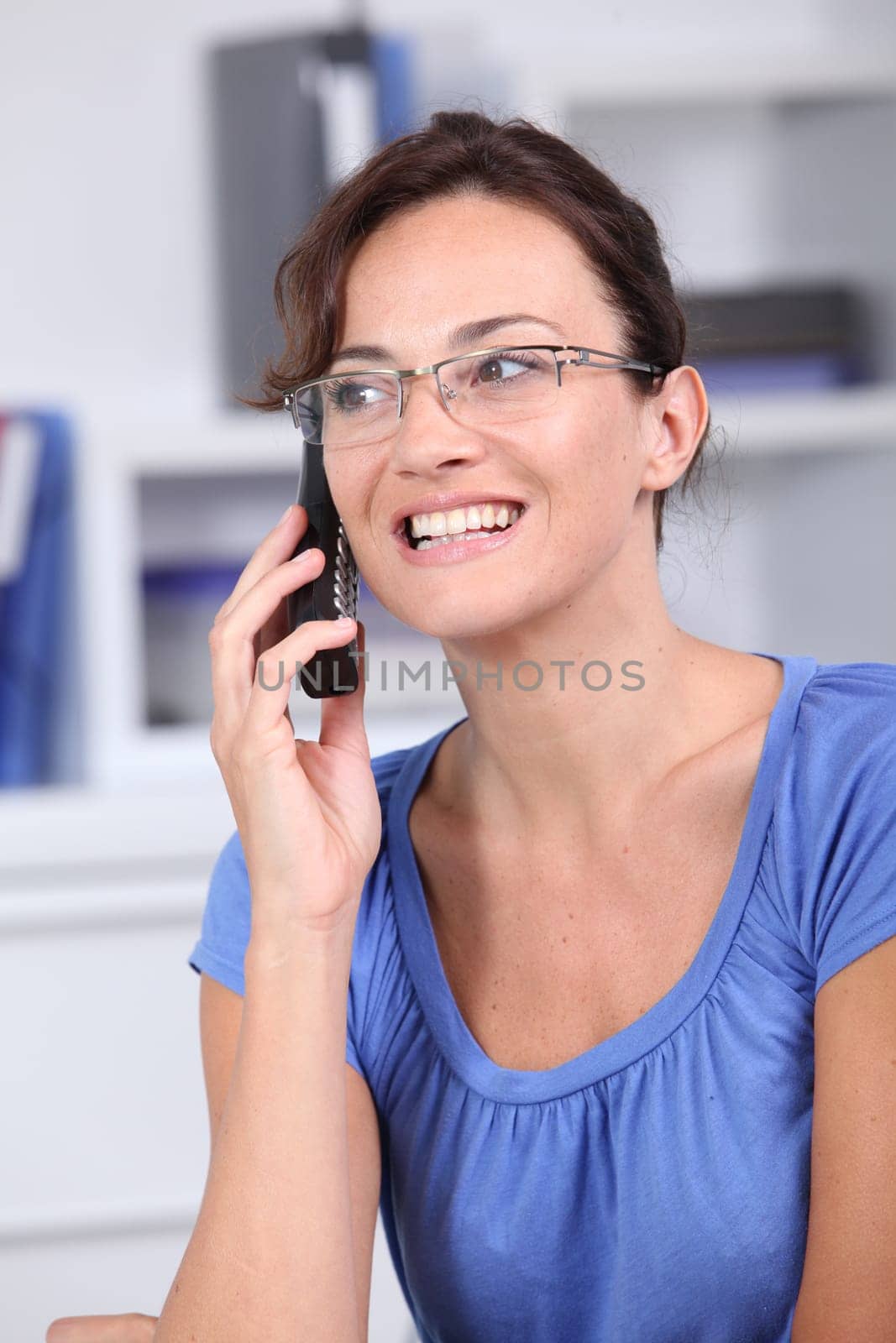 Closeup of beautiful woman with blue shirt
