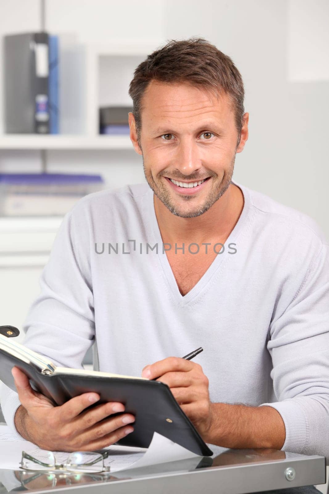 Man in the office talking on the phone