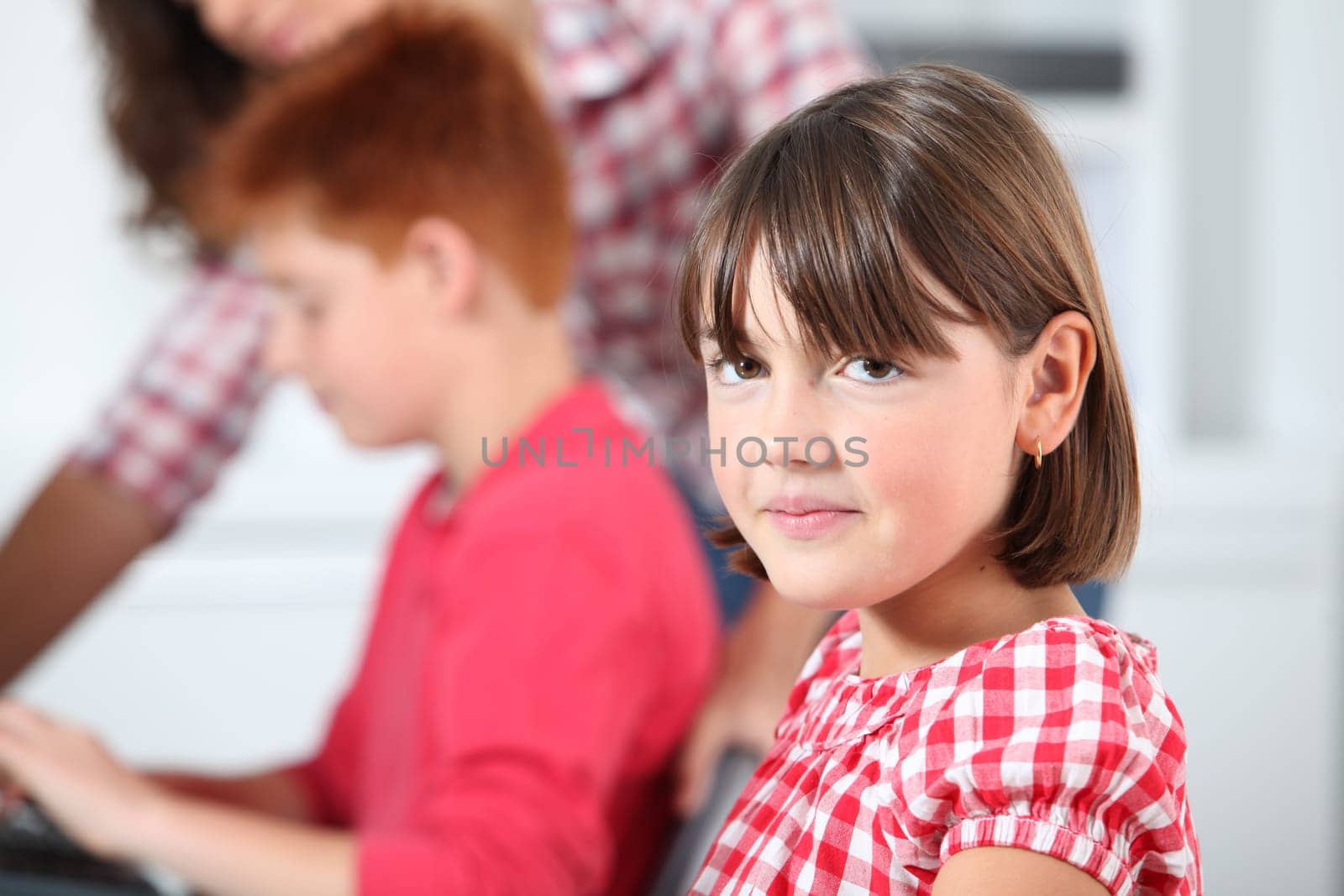Shy little girl at school
