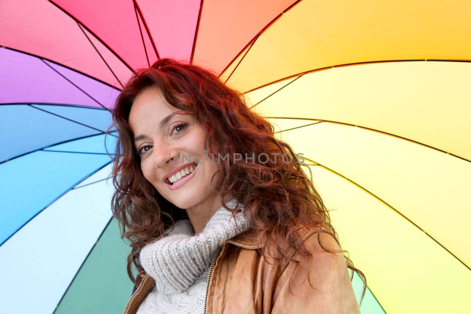 Beautiful smiling woman on a raining day