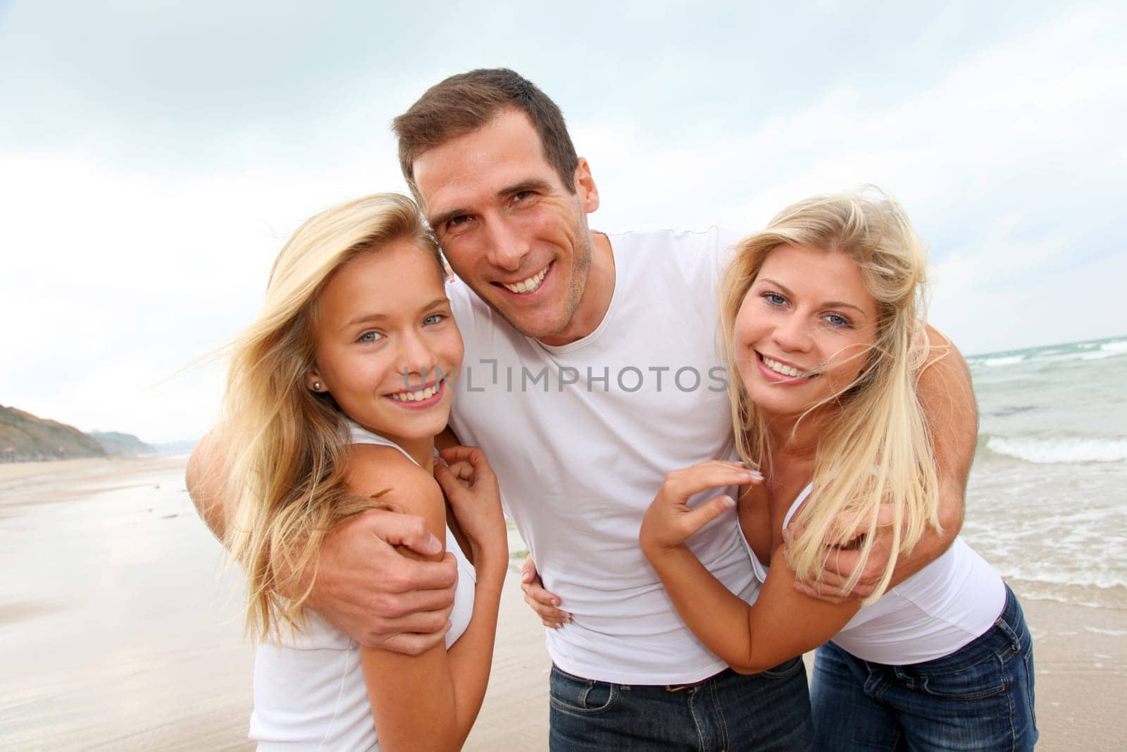Portrait of happy family at the beach