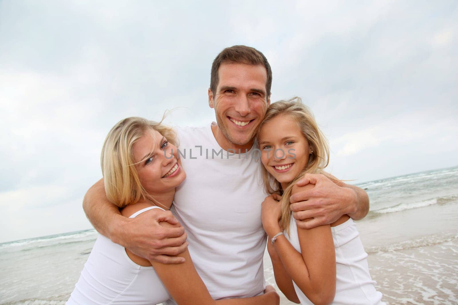 Portrait of happy family at the beach