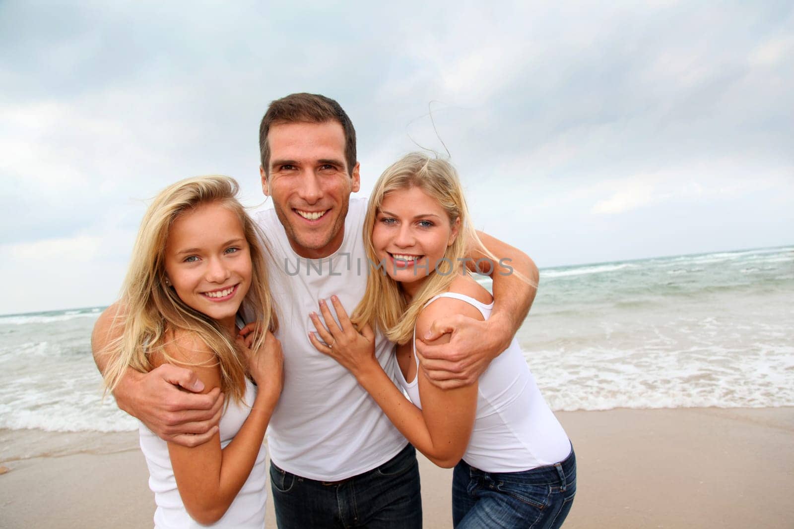 Portrait of happy family at the beach