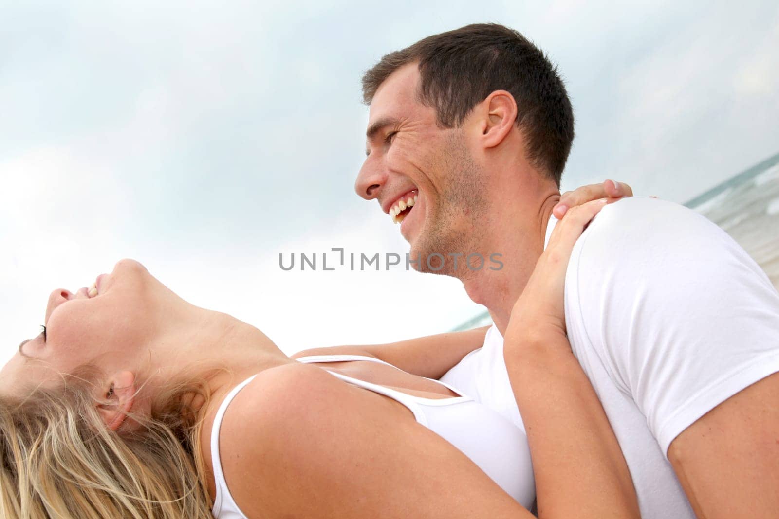 Couple having fun on a sandy beach
