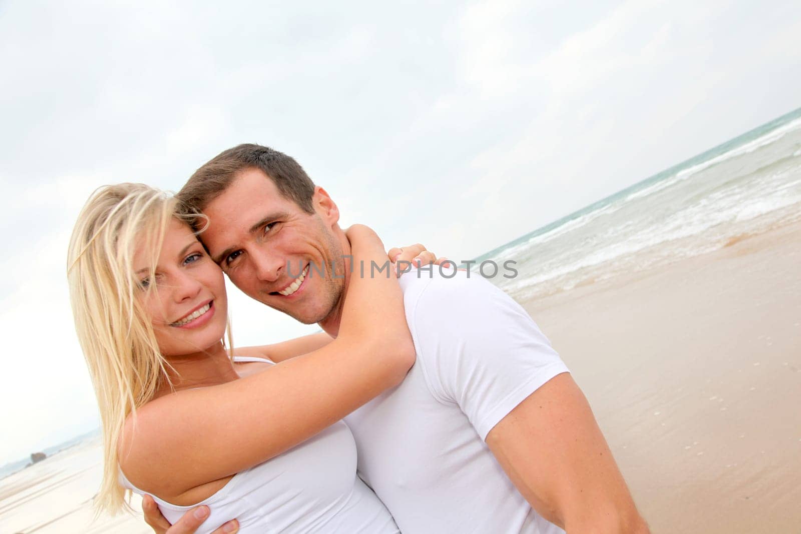 Couple having fun on a sandy beach