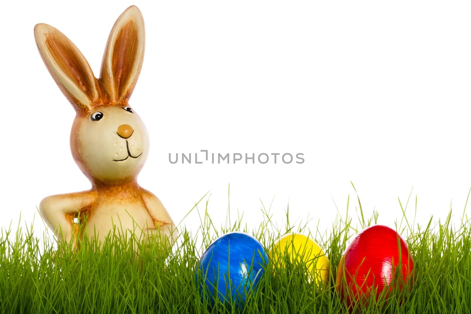 Easter Bunny Behind Grass With Easter Eggs
