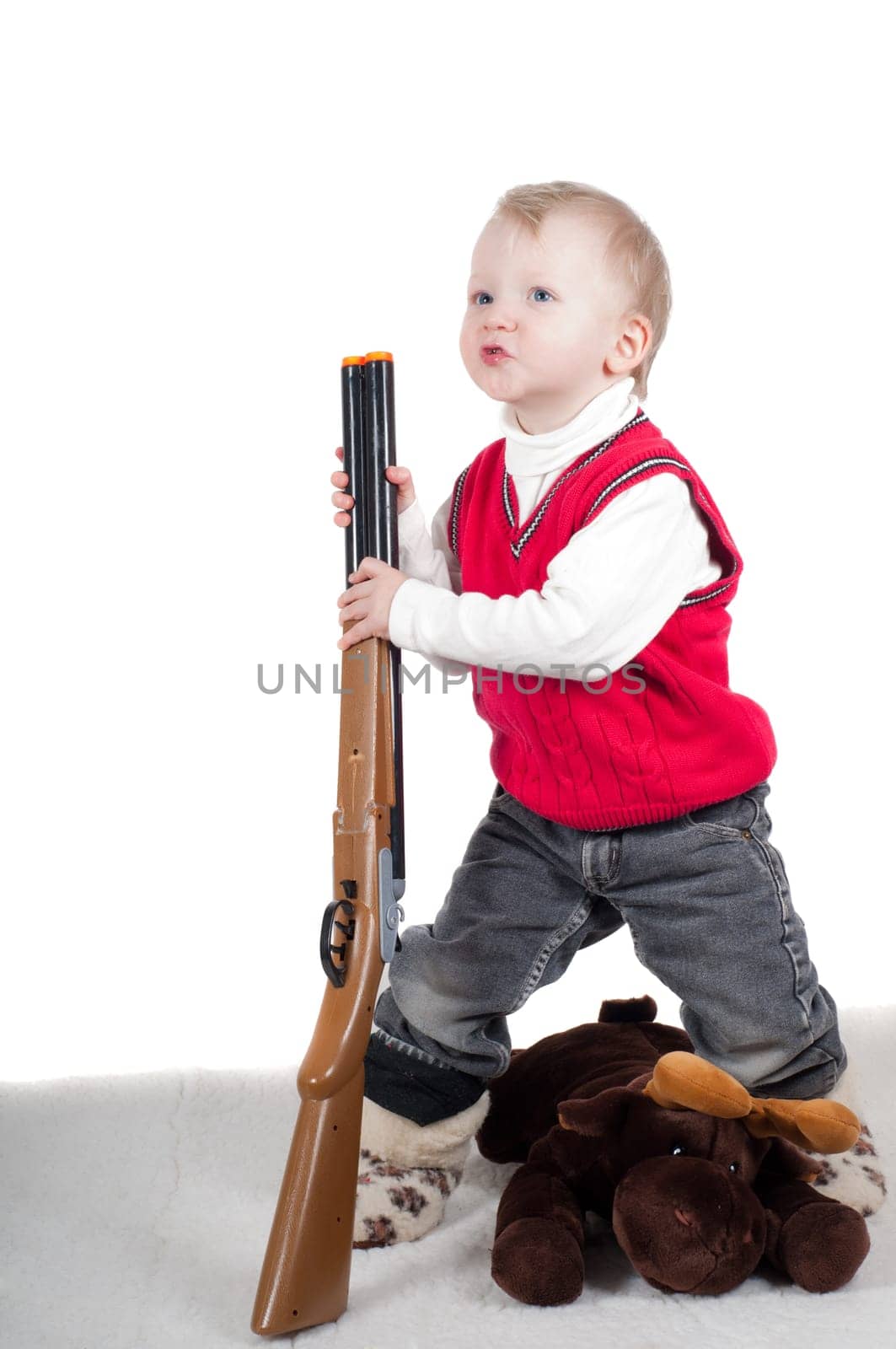 Little boy playing with gun