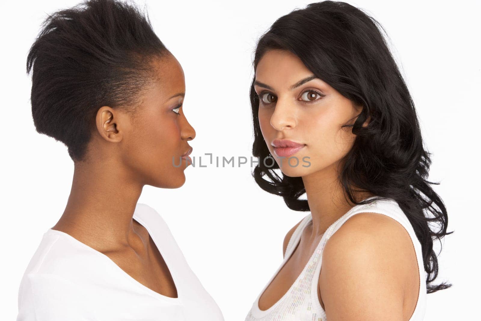 Portrait Of Two Attractive Young Women In Studio