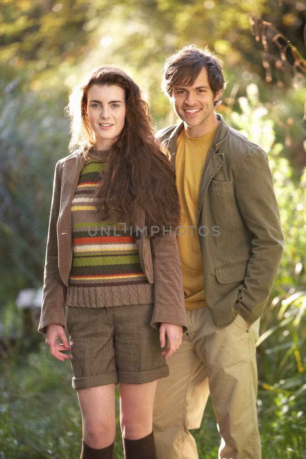 Portrait Of Romantic Young Couple In Autumn Landscape