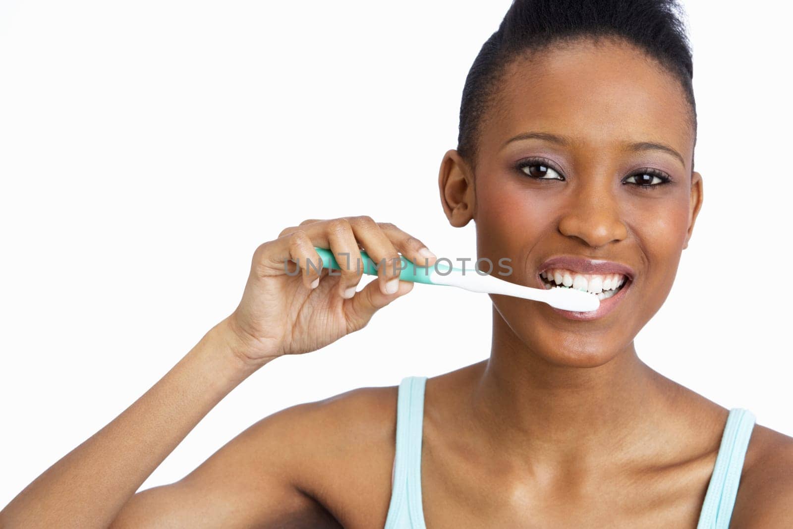 Young Woman Brushing Teeth In Studio