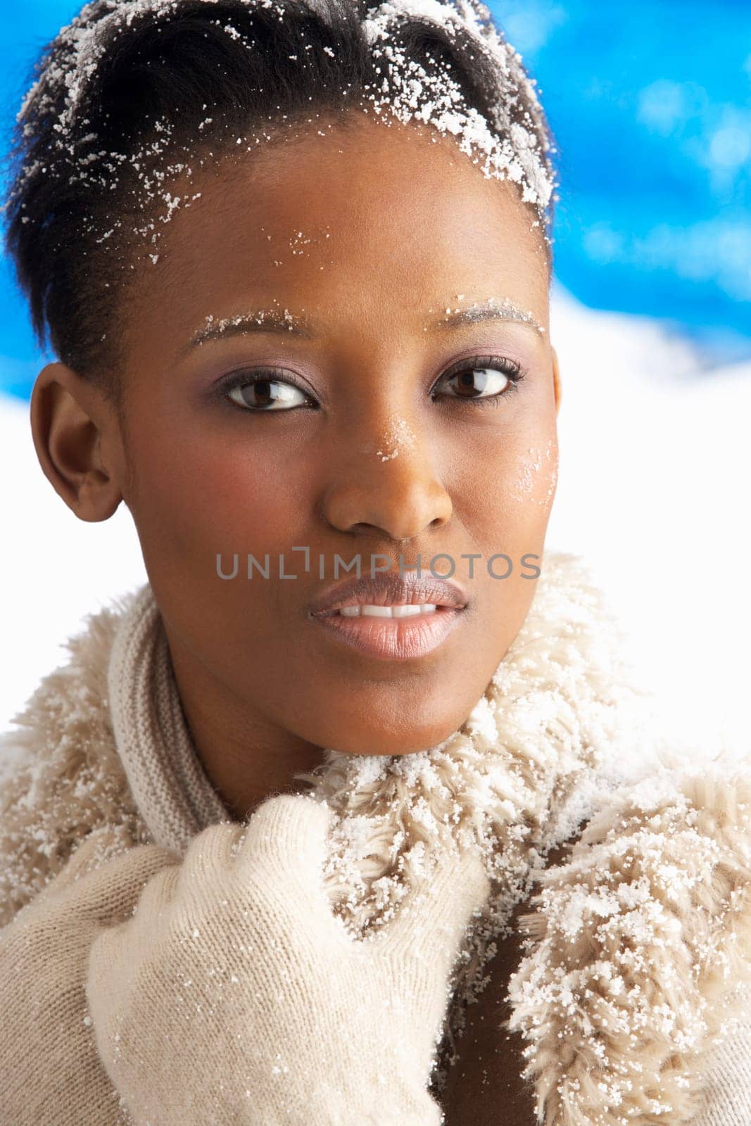 Young Woman Wearing Warm Winter Clothes In Studio