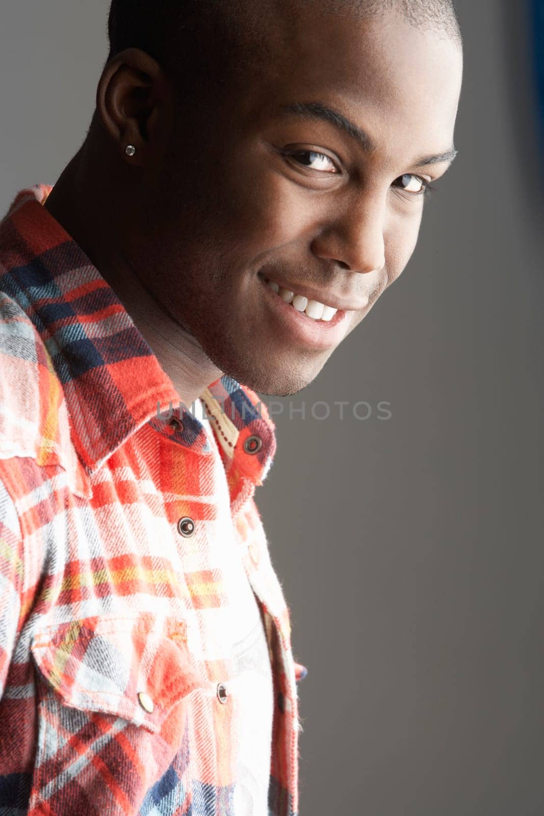 Fashionable Young Man Wearing Casual Clothes In Studio