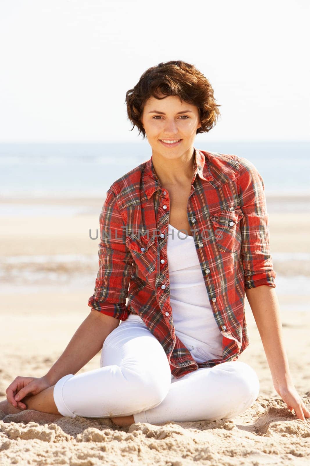 Young Woman Relaxing On Beach
