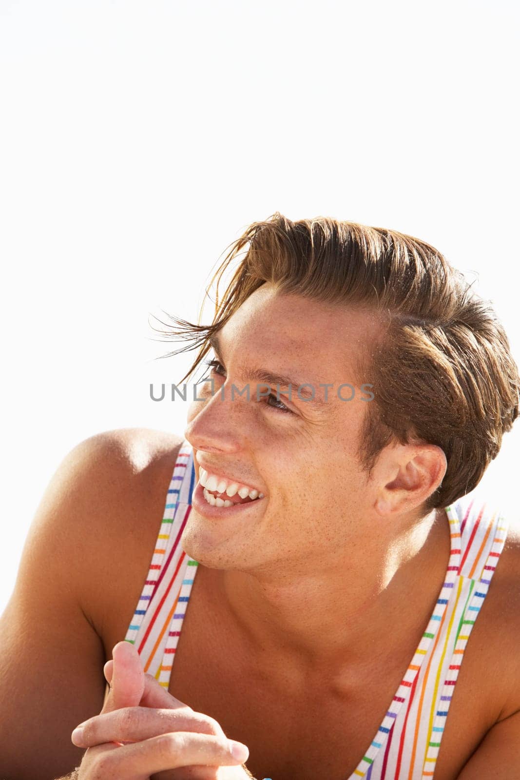 Young Man Sitting On Beach