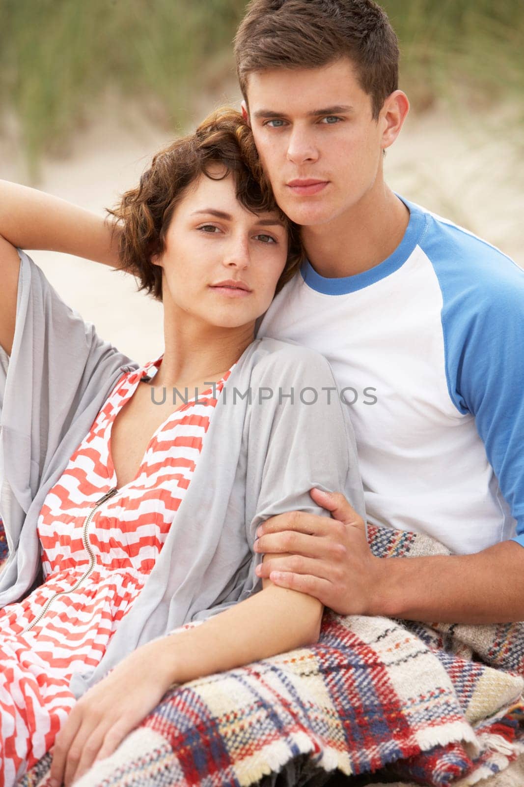 Romantic Young Couple Embracing On Beach