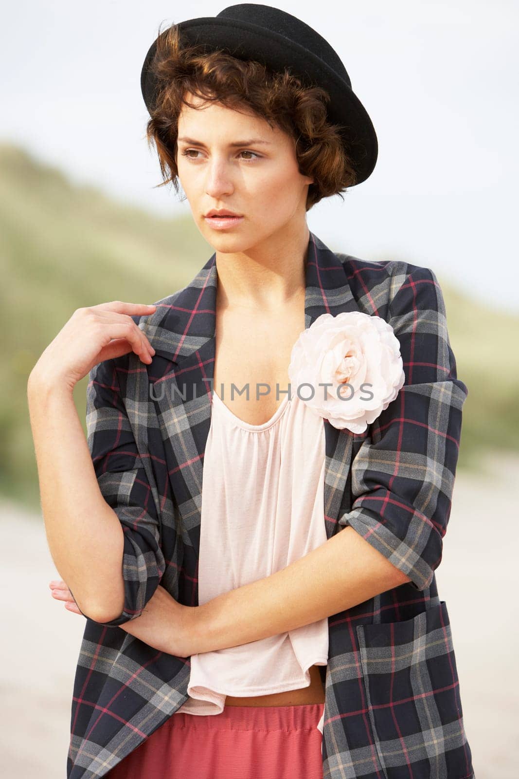 Fashionably Dressed Attractive Young Woman Standing Amongst Sand Dunes