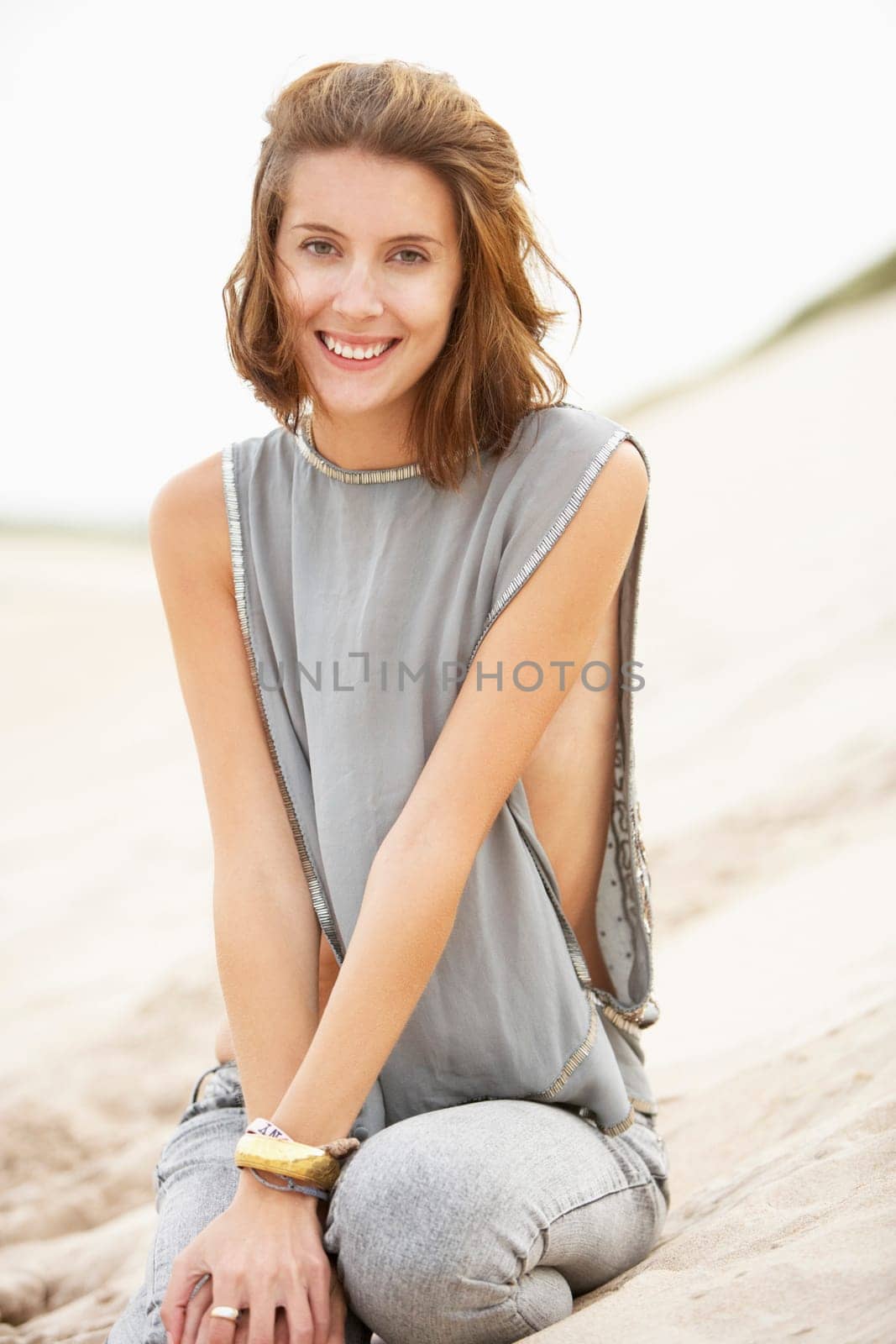 Attractive Young Woman Wearing Revealing Clothing Standing Amongst Sand Dunes