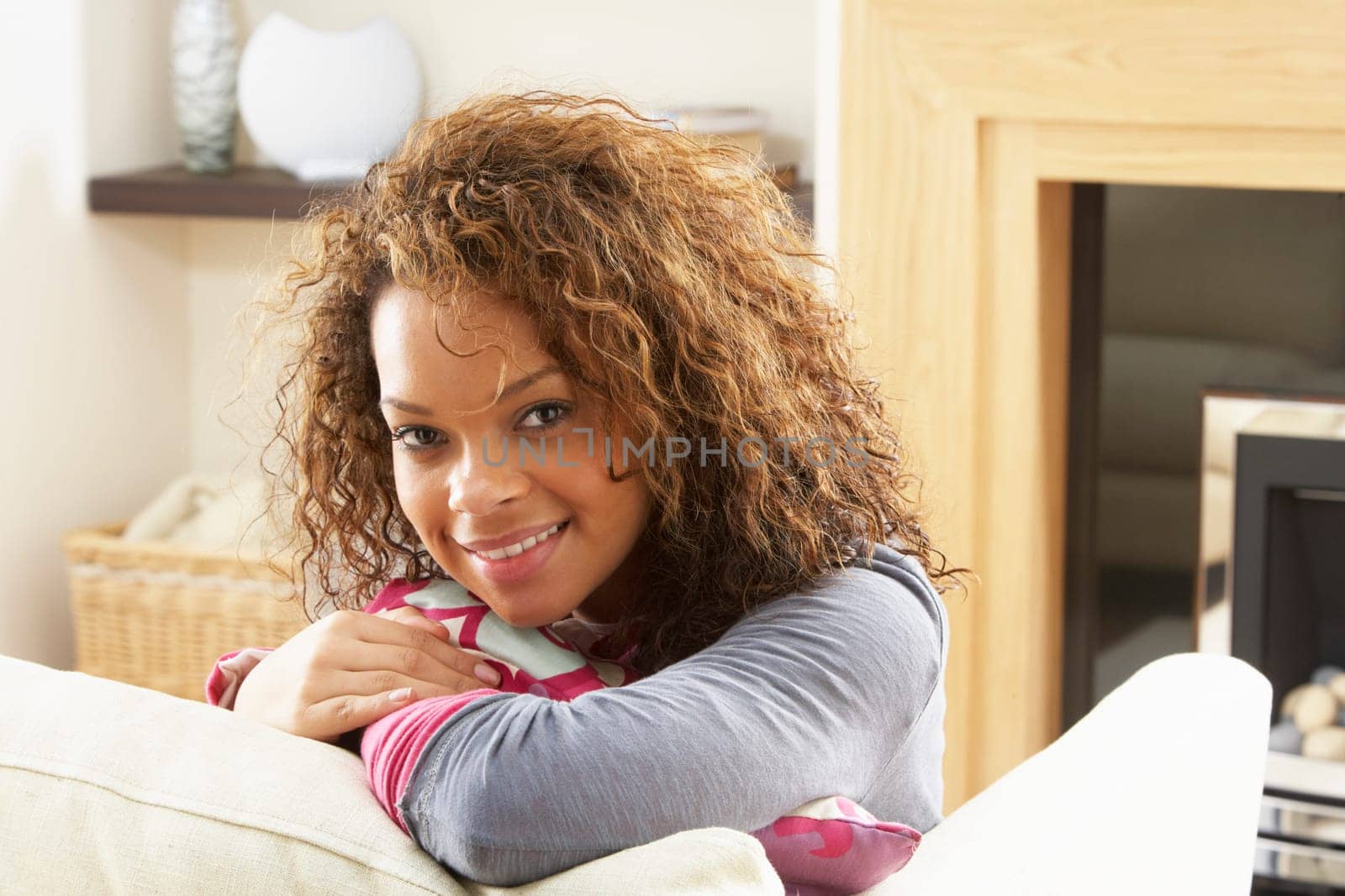 Woman Relaxing On Sofa At Home