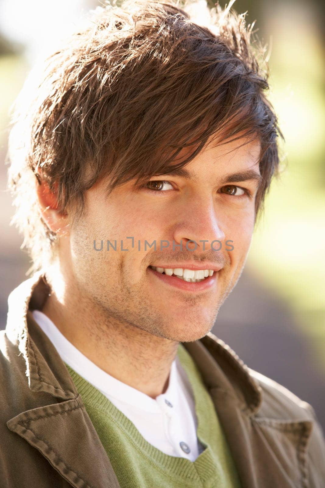 Portrait Of Young Man In Autumn Park