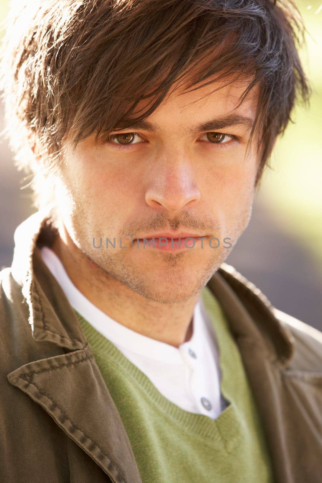 Portrait Of Young Man In Autumn Park