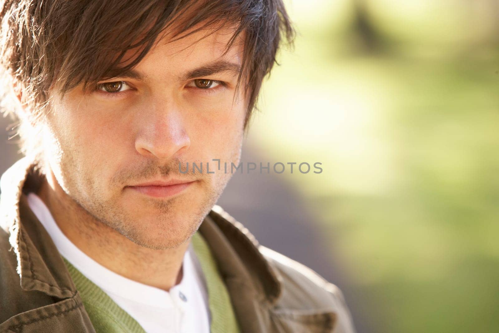 Portrait Of Young Man In Autumn Park