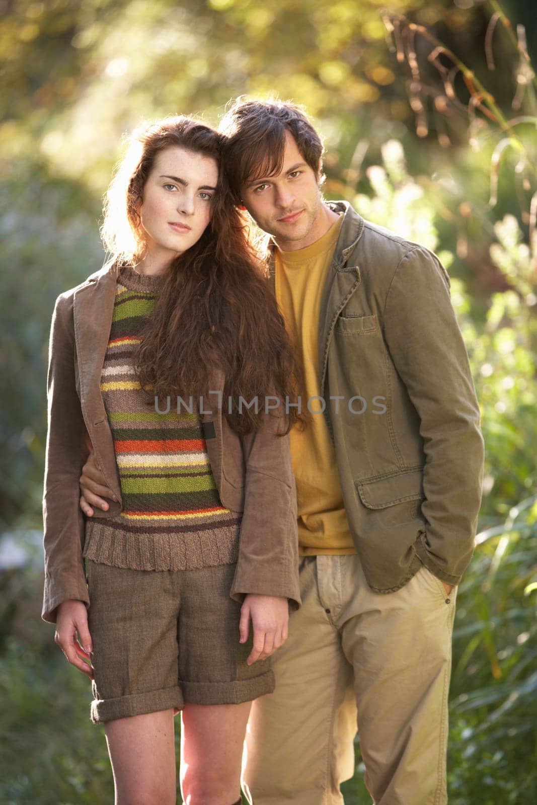 Portrait Of Romantic Young Couple In Autumn Landscape