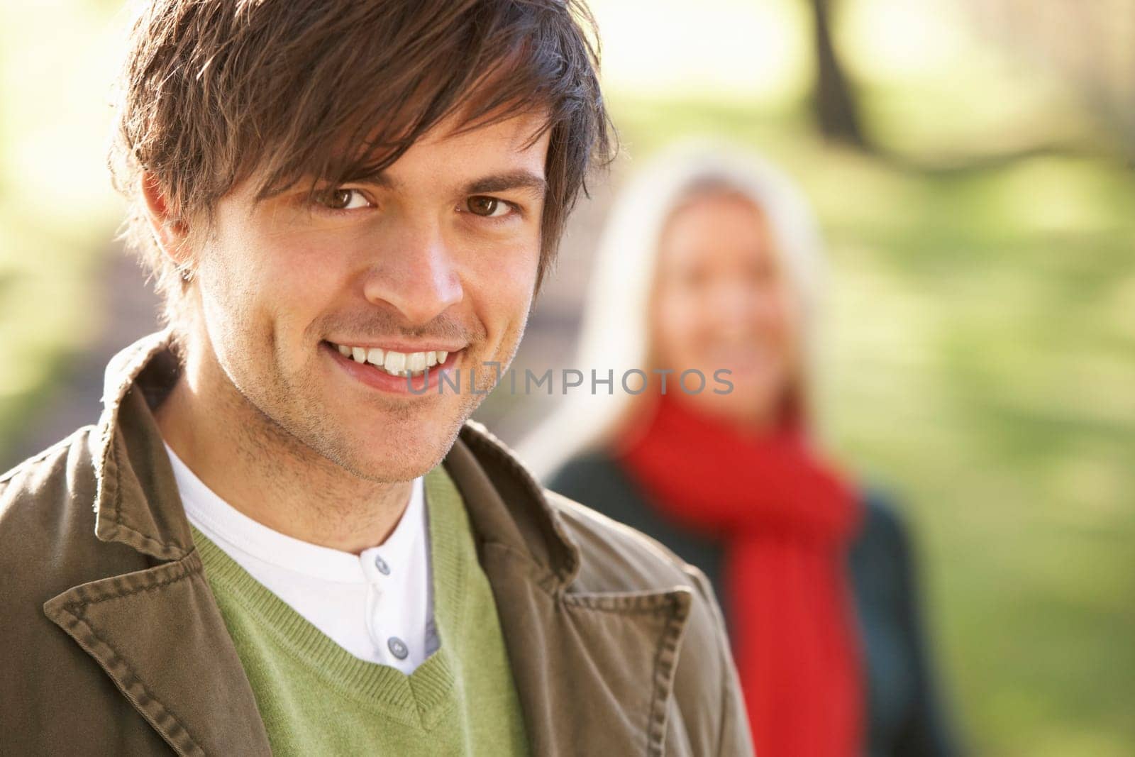 Portrait Of Romantic Young Couple In Autumn Park
