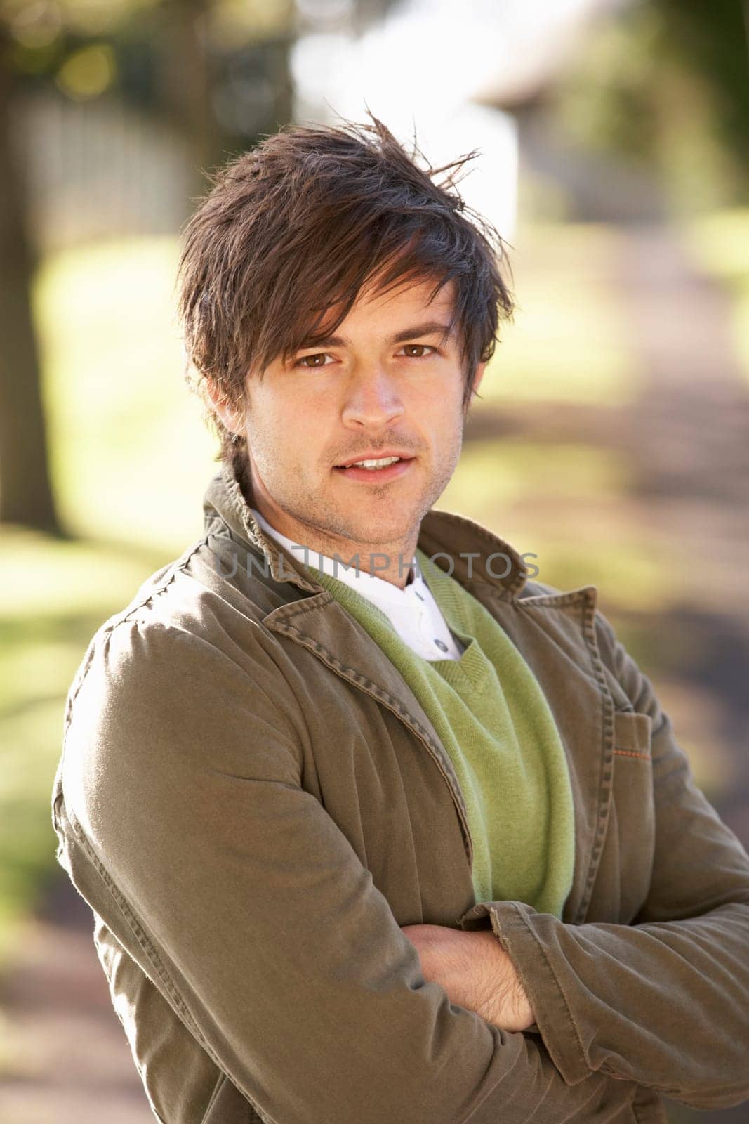 Portrait Of Young Man In Autumn Park