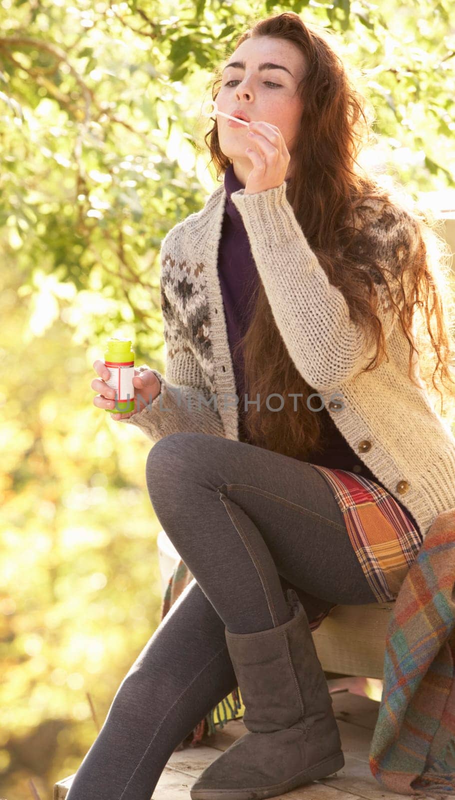 Portrait Of Beautiful Teenage Girl Outdoors In Autumn Landscape Blowing Bubbles