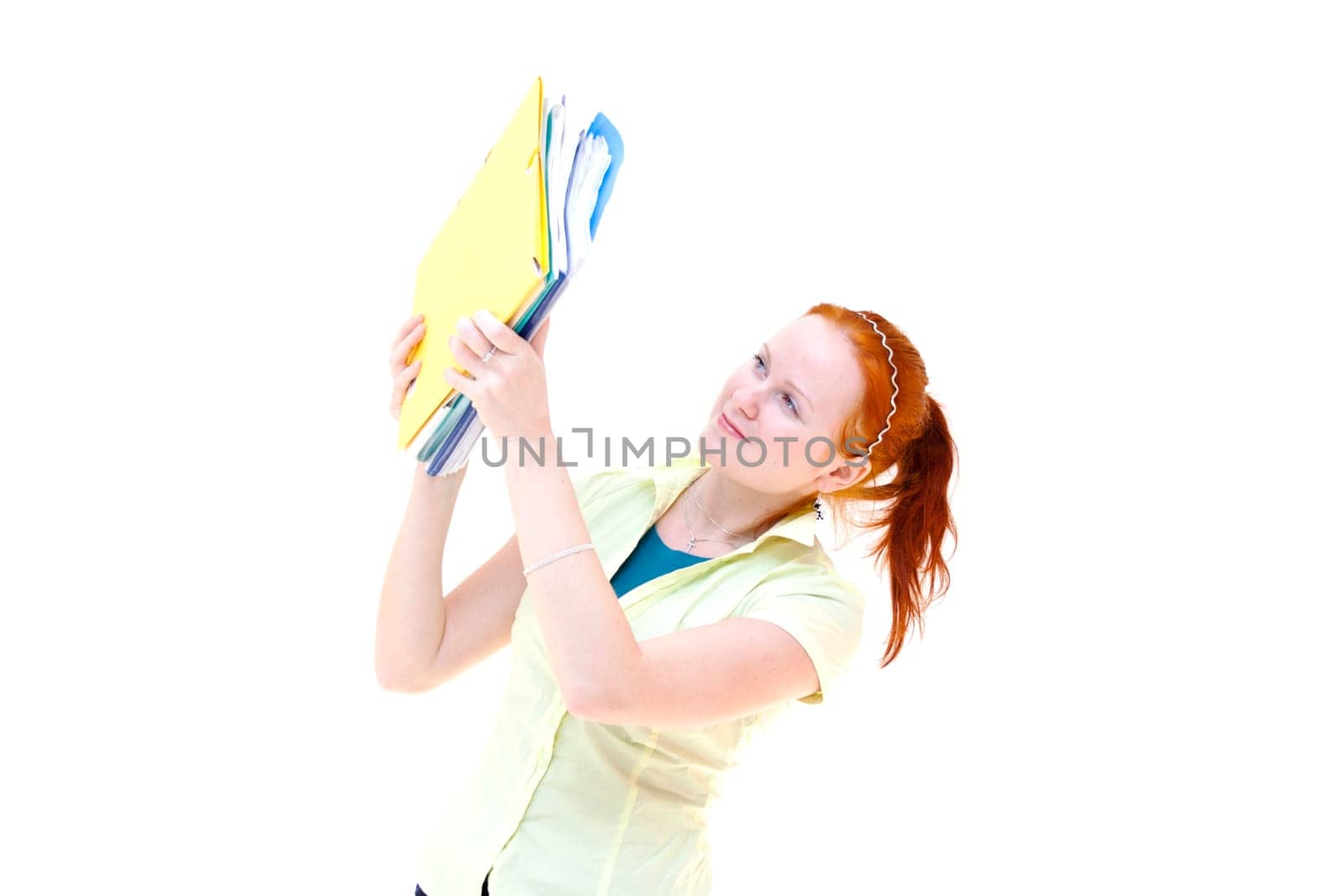 redhead young woman student holding a notebooks