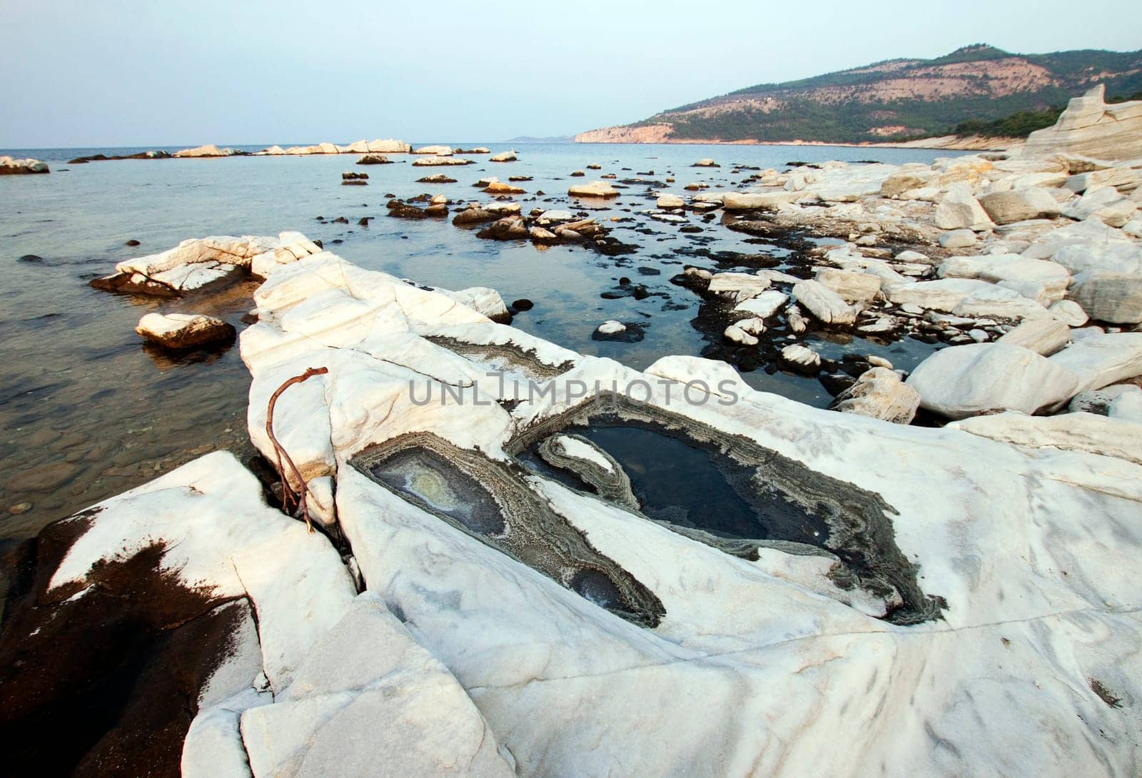 Blocks of marble in the sea on Aliki