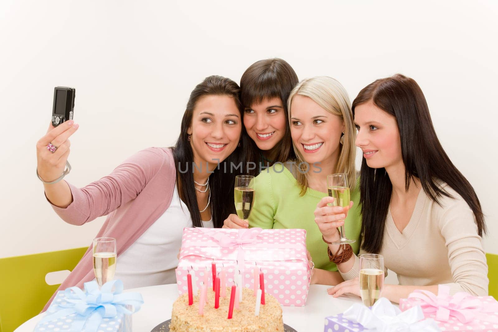 Birthday party - cheerful woman take photo with camera