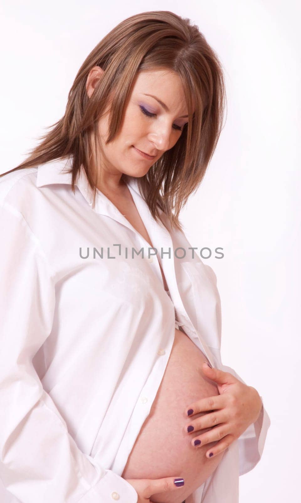 Portrait of beautiful pregnant woman hol