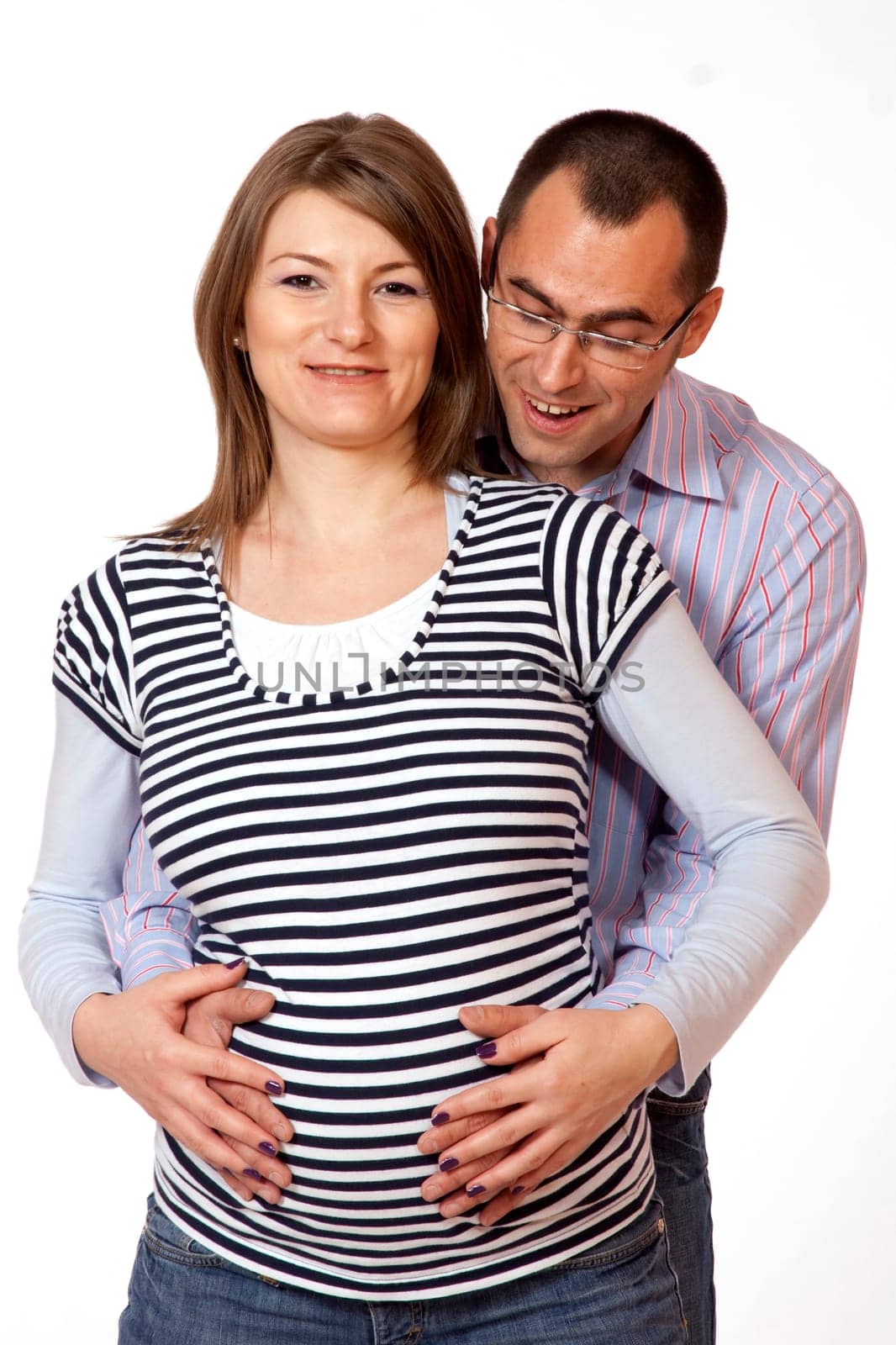 Happy young man and his pregnant wife