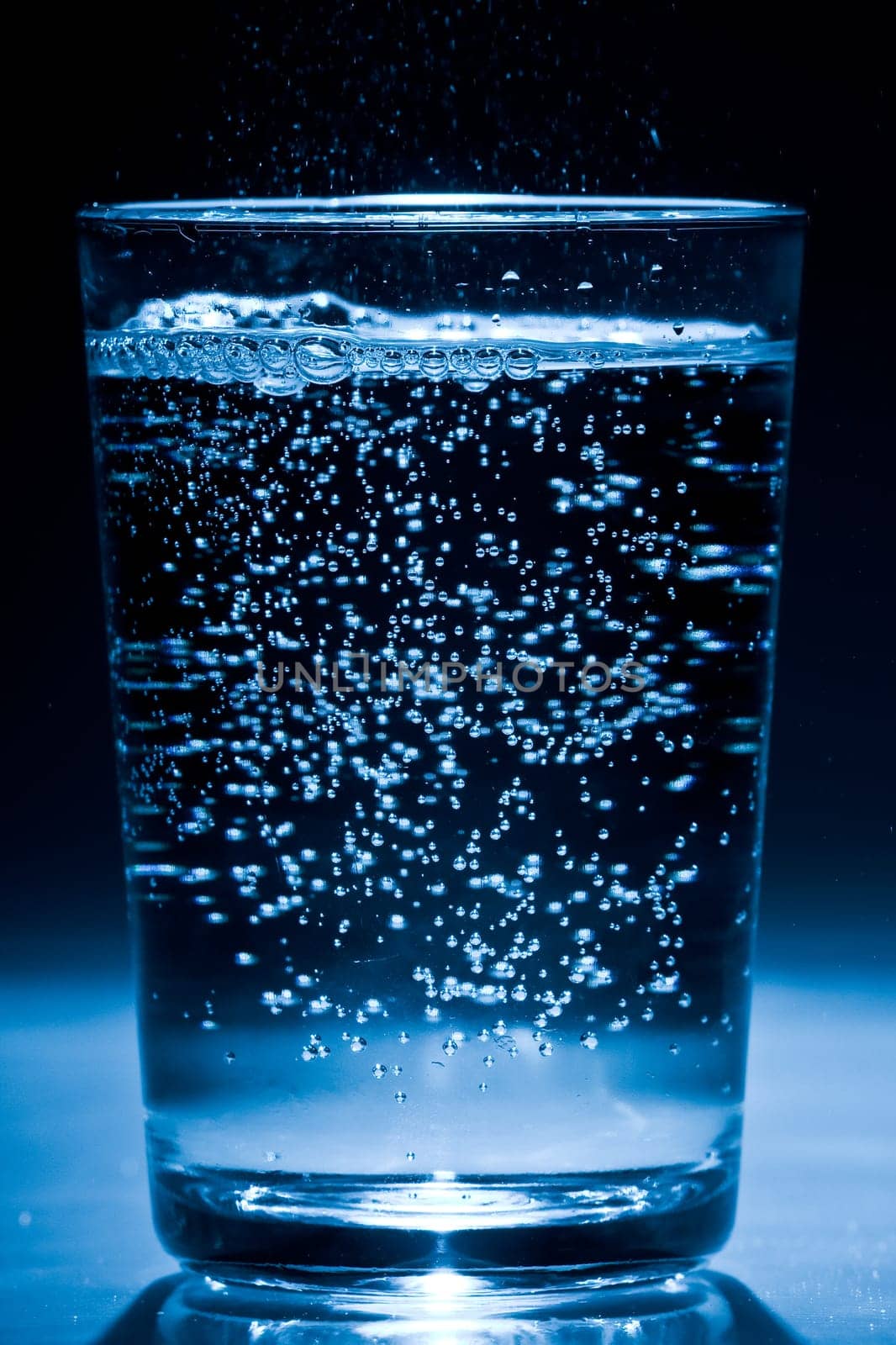 Glass of water with air bubbles