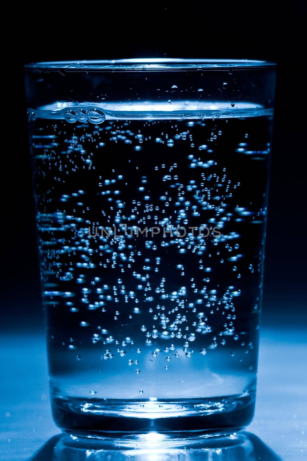 Glass of water with air bubbles
