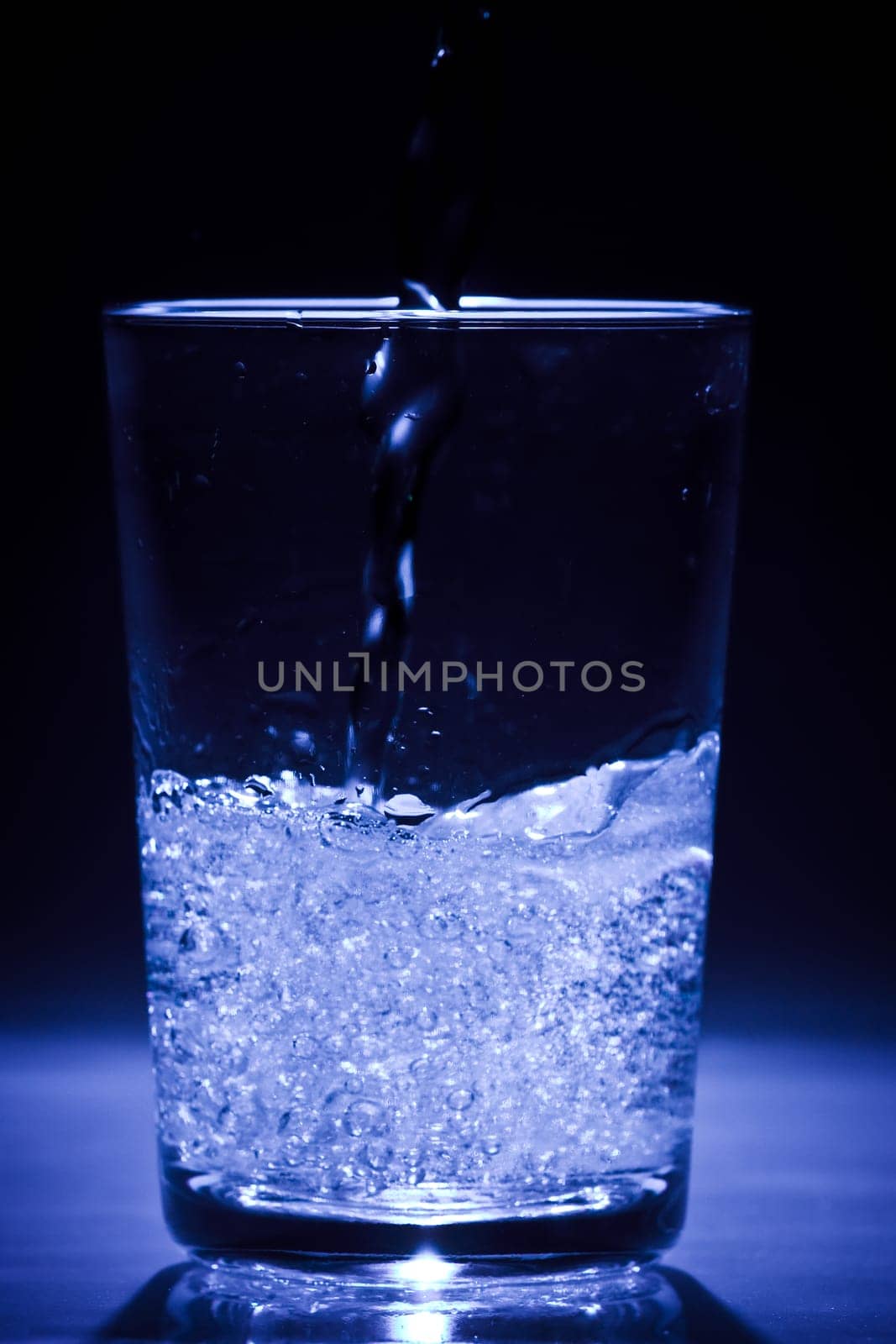 Glass of water with air bubbles