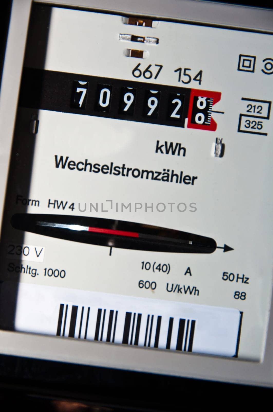 closeup on electricity usage meter with German text