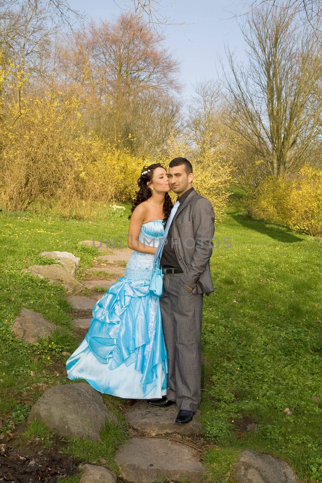ethnic couple at engagement or wedding. young turkish people together in love with blue dress and suit