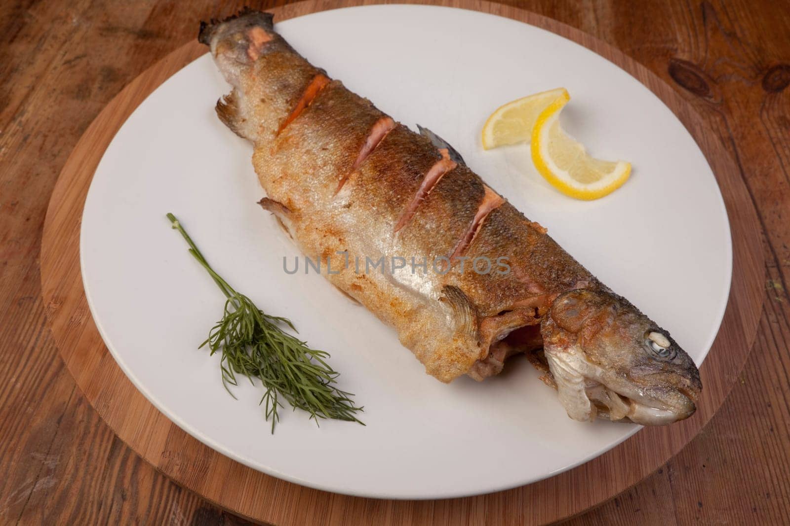 fish dinner of rainbow trout. fresh healthy meal on plate