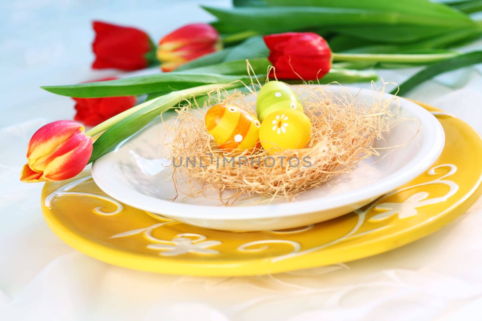 Easter eggs with tulips for spring table decoration