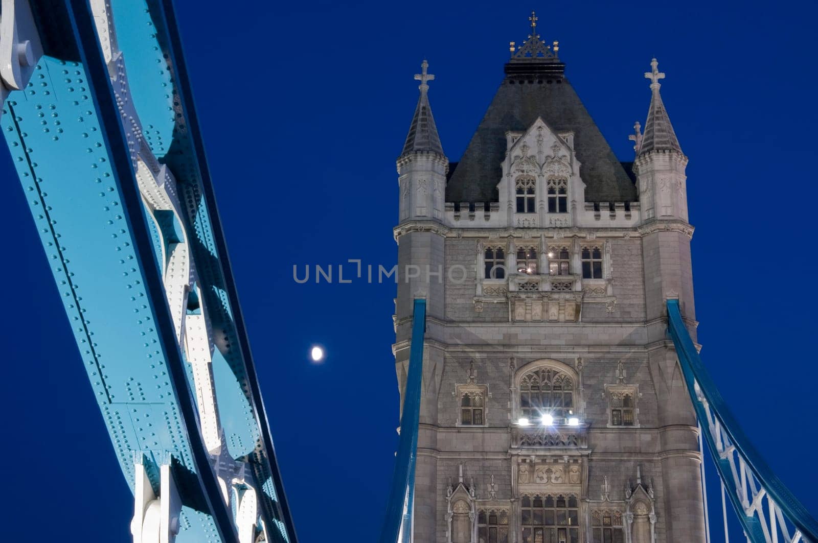 Low angle shot of Tower Bridge detail in London at dusk.