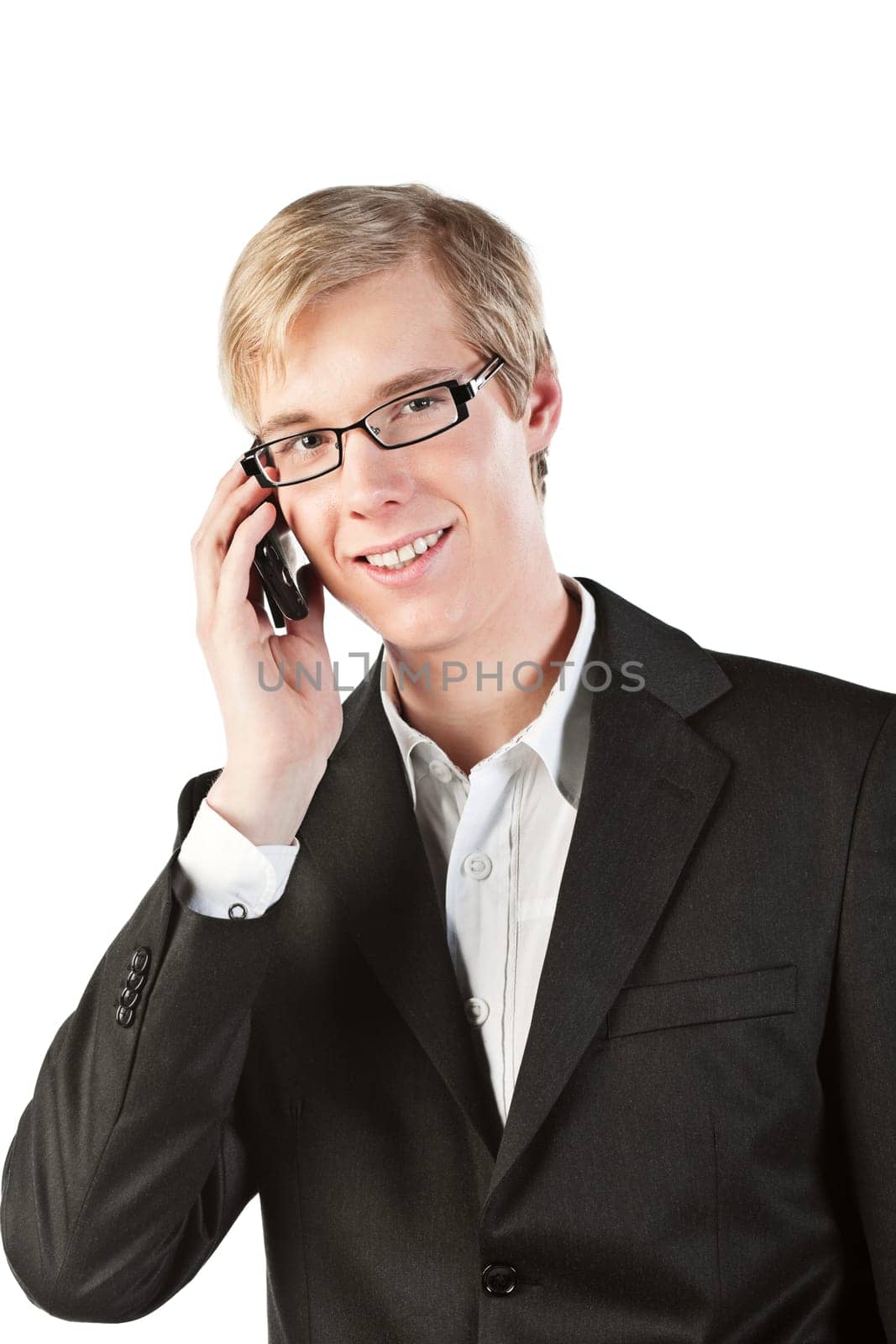 Young handsome smiling blond man speaking on the cellphone, isolated on white.