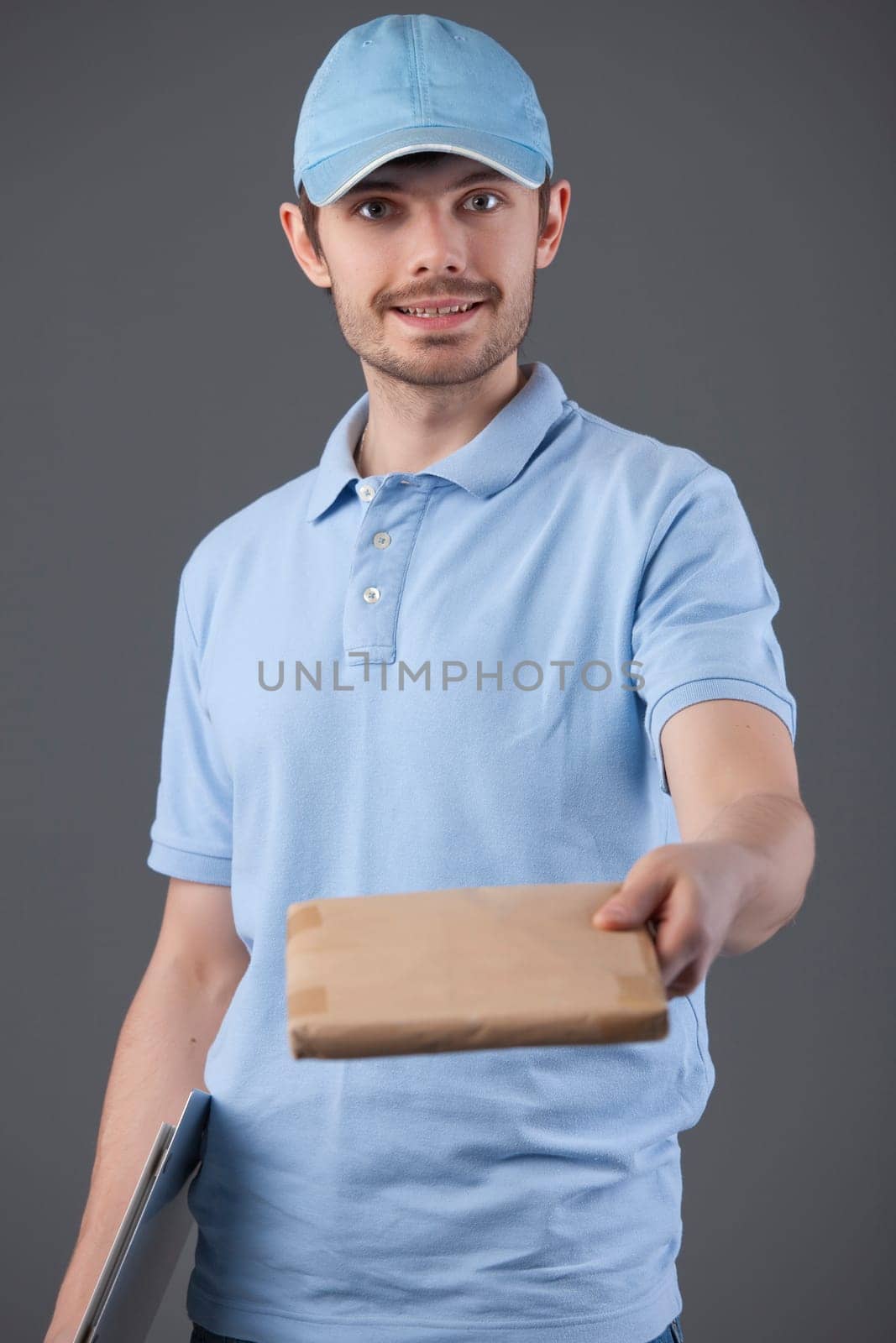 delivery courier with small package in his hand