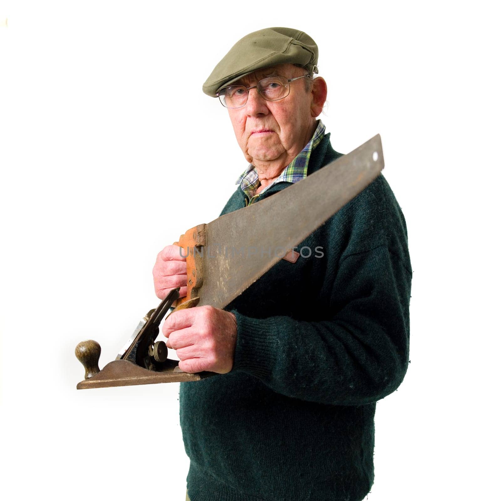 Senior Man holding old work tools