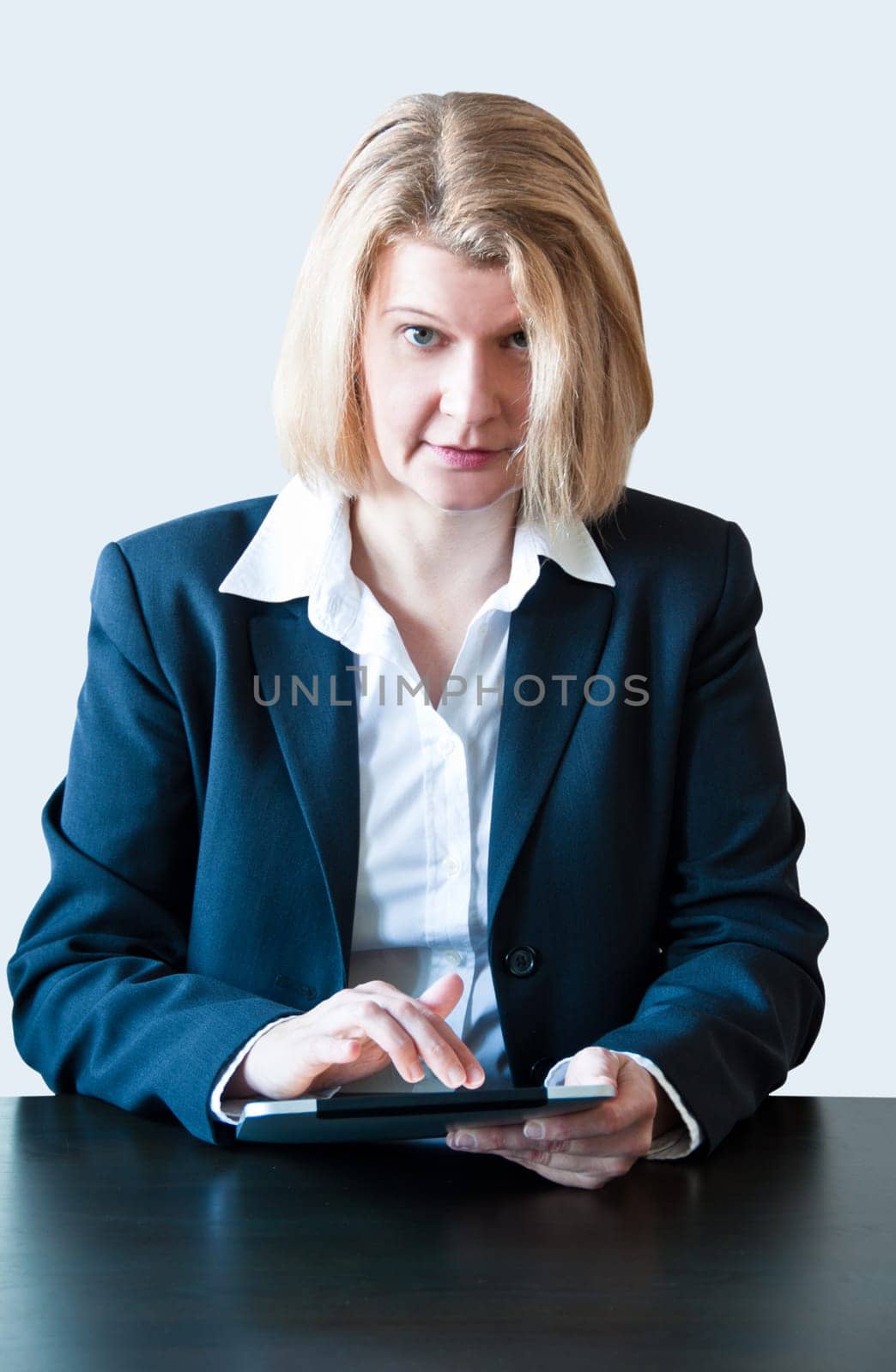 Closeup of a business woman with tablet pc and headset