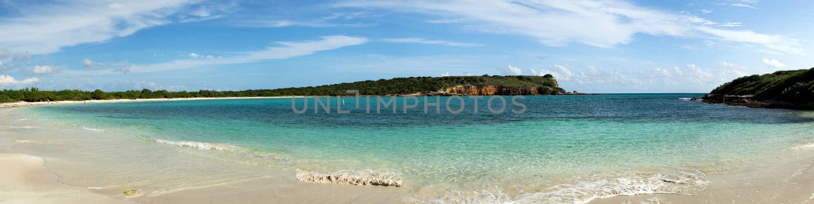 Circular sandy bay off the south west coast of Puerto Rico by Los Morillos Lighthouse