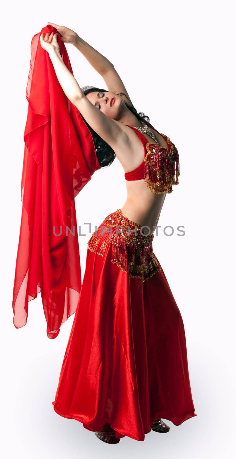 Beauty woman in dance with red veil  - arabian costume