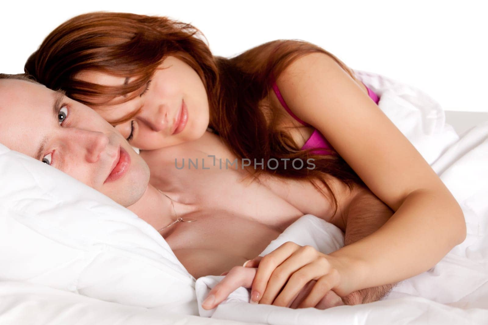 Young couple on a bed with emotions
